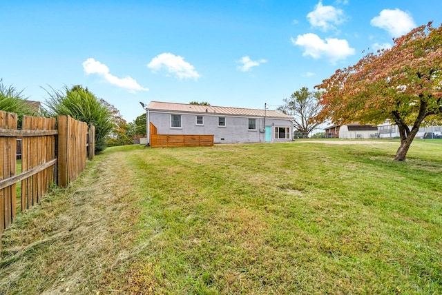 back of property featuring a lawn