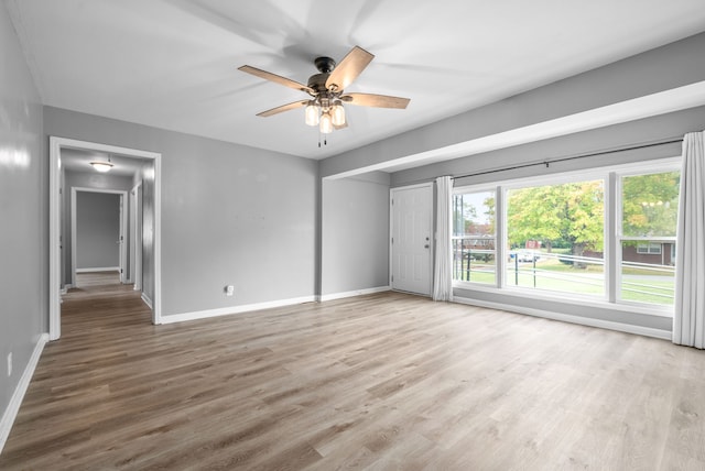 spare room with ceiling fan and hardwood / wood-style floors