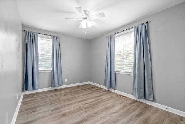 unfurnished room with light hardwood / wood-style floors and ceiling fan