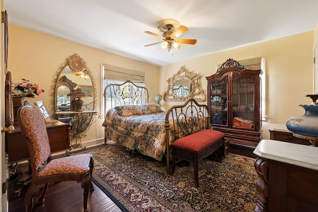 bedroom featuring hardwood / wood-style flooring and ceiling fan