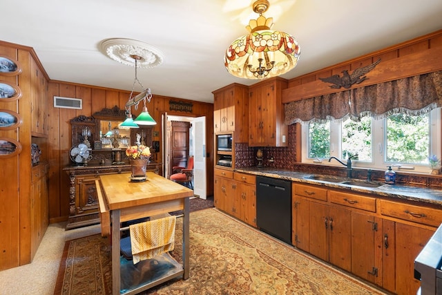 kitchen with stainless steel microwave, wood walls, dishwasher, carpet floors, and sink