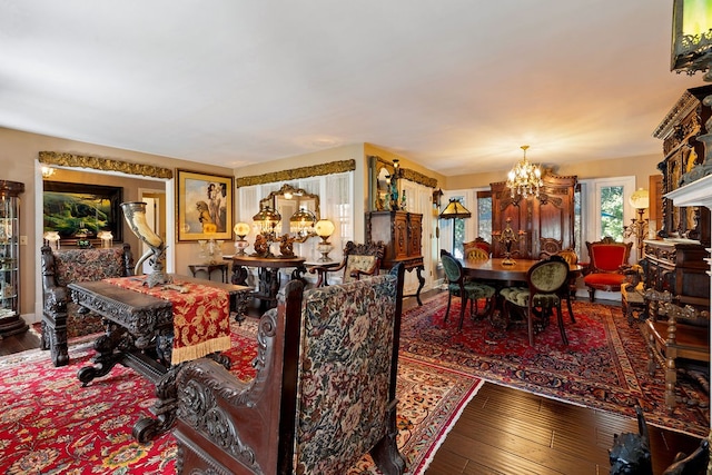 living room featuring an inviting chandelier and hardwood / wood-style floors