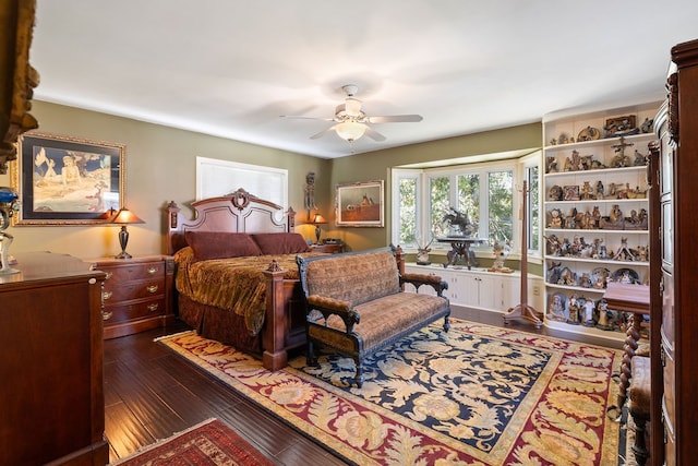 bedroom with ceiling fan and dark hardwood / wood-style flooring