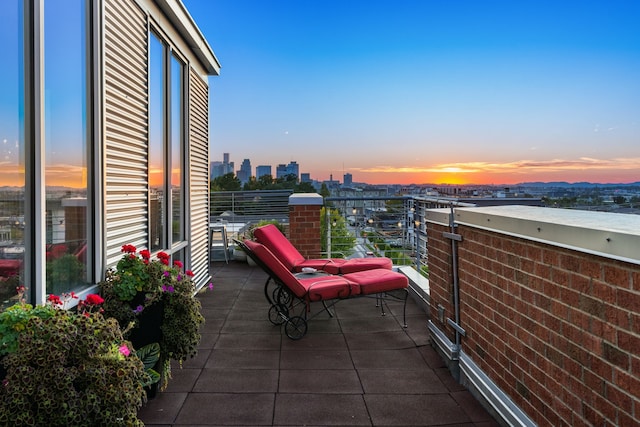 view of balcony at dusk