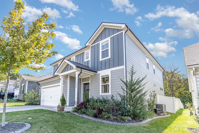 view of front of house featuring a front yard, a garage, and cooling unit