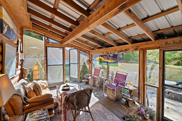 sunroom with vaulted ceiling with beams