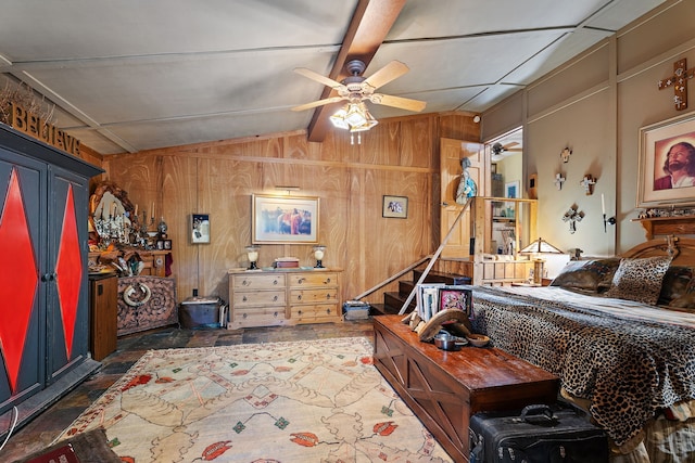 bedroom with ceiling fan, wood walls, and lofted ceiling