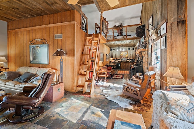 miscellaneous room with wooden ceiling and wood walls