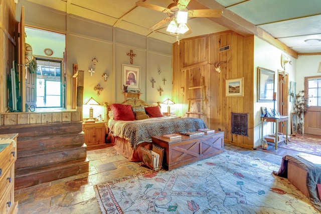 bedroom featuring multiple windows and ceiling fan