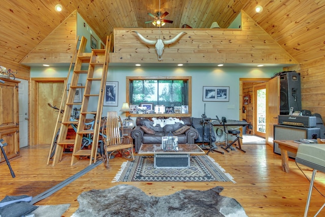 living room featuring wood ceiling, light wood-type flooring, high vaulted ceiling, and ceiling fan