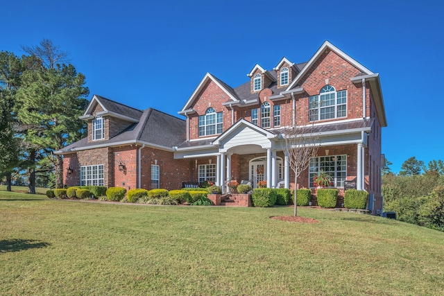 view of front of house featuring a porch and a front lawn