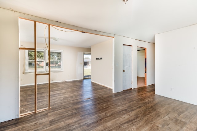 spare room with dark hardwood / wood-style flooring