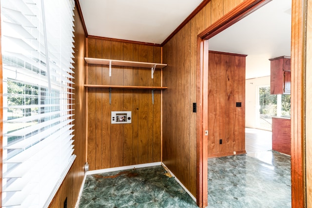 washroom featuring hookup for a washing machine, ornamental molding, and wooden walls