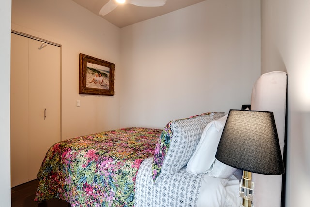 bedroom featuring hardwood / wood-style flooring, a closet, and ceiling fan