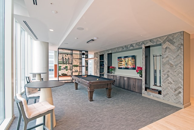 game room with wood-type flooring, a wall of windows, and billiards