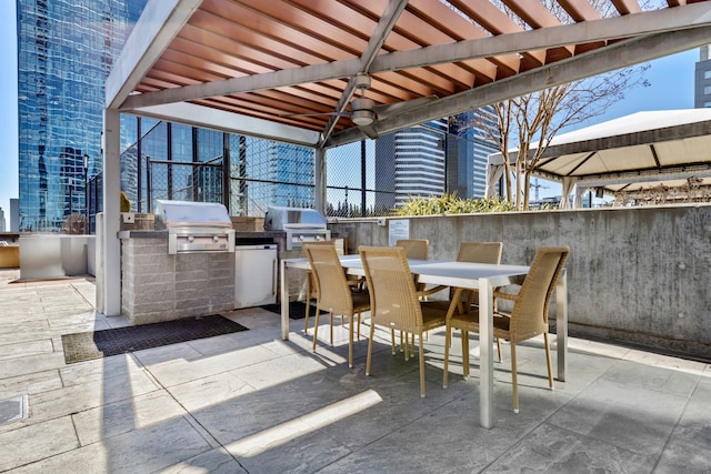 view of patio featuring a gazebo, area for grilling, and exterior kitchen