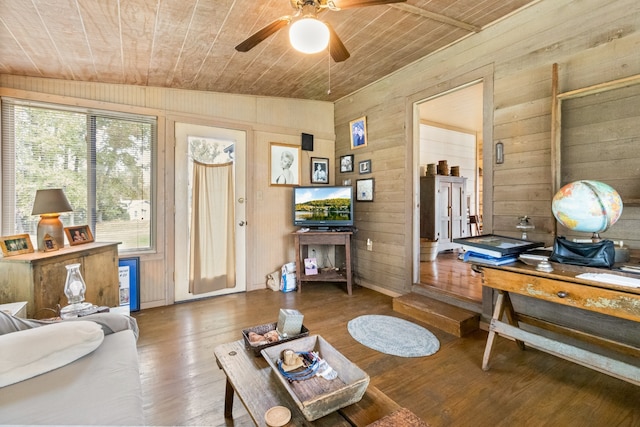 living room featuring hardwood / wood-style floors, lofted ceiling, wooden walls, and wood ceiling