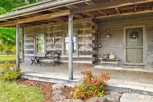 doorway to property featuring a porch