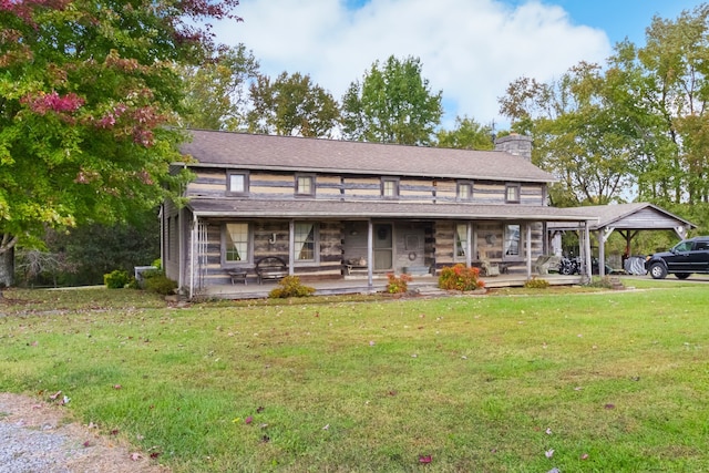 view of front of home with a front yard, covered porch, and a carport