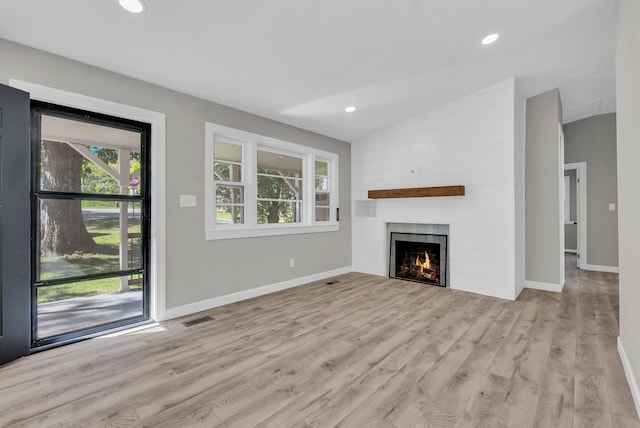 606 S Chestnut St, Monterey, TN 38574 - unfurnished living room with a healthy amount of sunlight, vaulted ceiling, wood finished floors, and visible vents