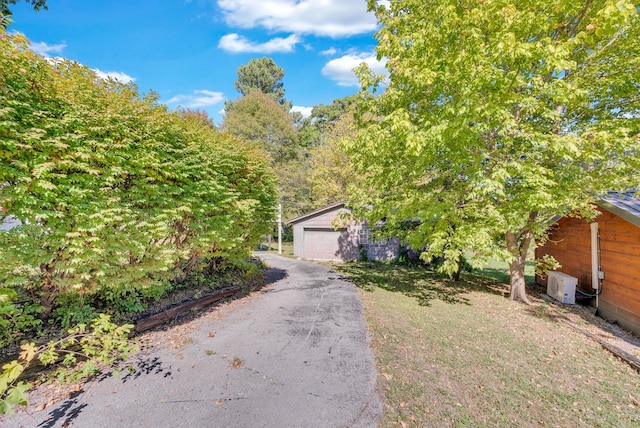 606 S Chestnut St, Monterey, TN 38574 - view of front of house featuring a garage and an outdoor structure