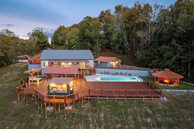 43 Landfill Ln, Brush Creek, TN 38547 - back of property with a fenced backyard, a gazebo, a deck, a yard, and an outdoor fire pit