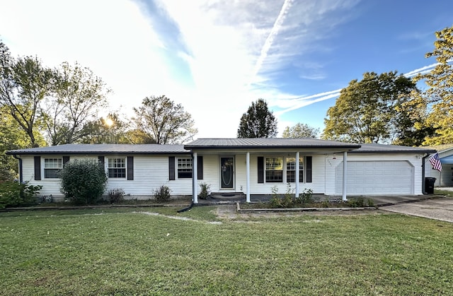 ranch-style home featuring a front lawn and a garage