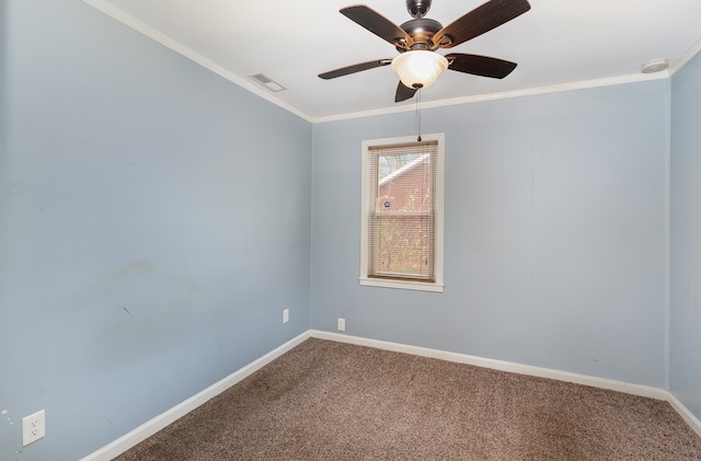 unfurnished room featuring ceiling fan, ornamental molding, and carpet floors