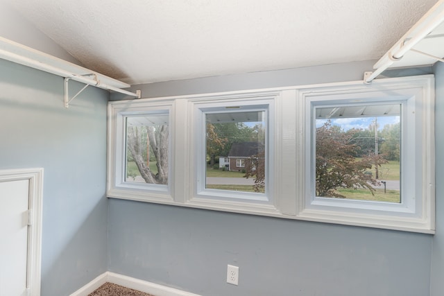 interior space featuring a textured ceiling