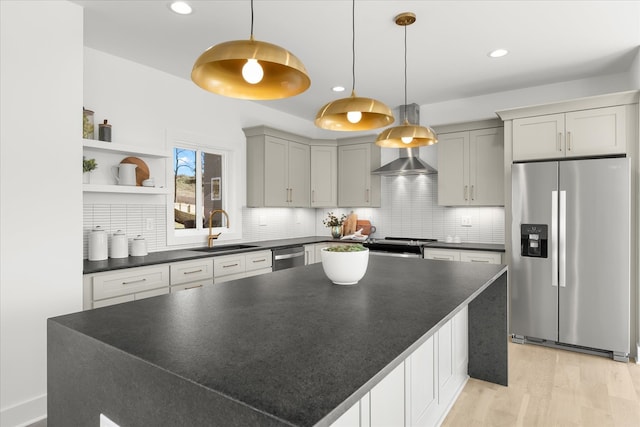 kitchen with light hardwood / wood-style flooring, backsplash, stainless steel appliances, and sink