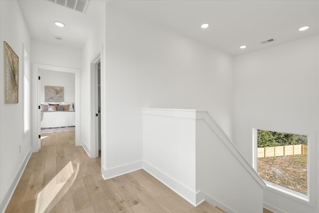 hallway with light wood-type flooring