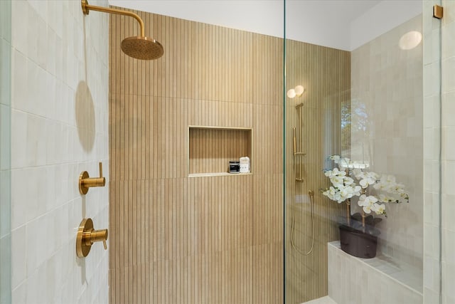 bathroom with a tile shower