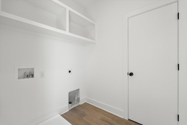 washroom featuring hardwood / wood-style flooring, washer hookup, and electric dryer hookup