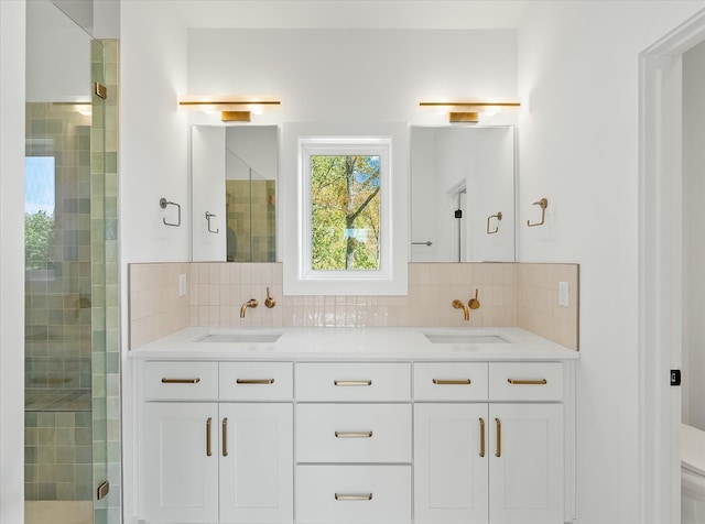 bathroom with vanity, decorative backsplash, a shower with shower door, and toilet