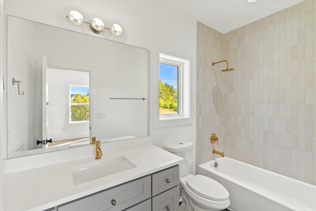 full bathroom with vanity, toilet, and tiled shower / bath