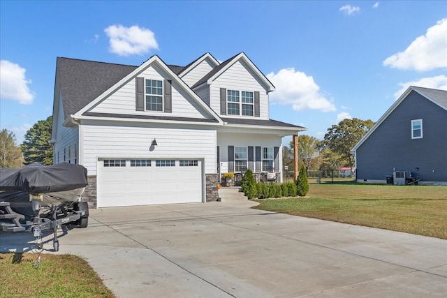 craftsman-style house featuring a front yard, a garage, cooling unit, and a porch