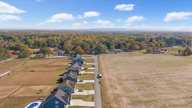 birds eye view of property with a rural view