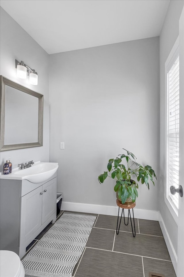 bathroom with vanity and toilet