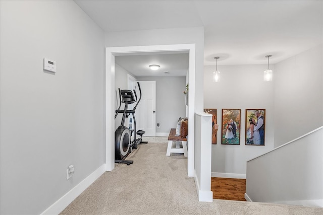 exercise room with light carpet