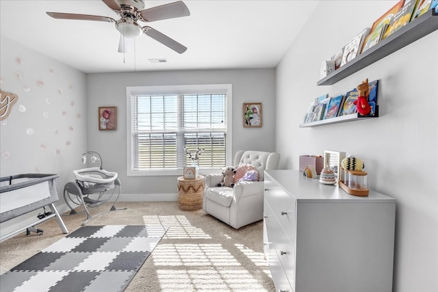 interior space with ceiling fan