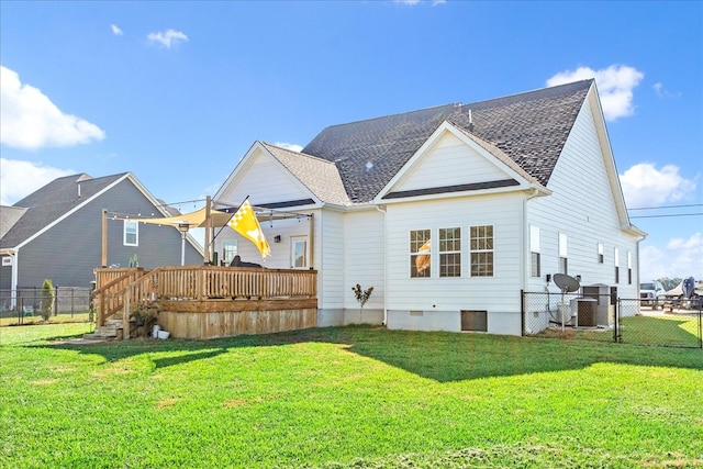 back of property featuring a yard and a deck