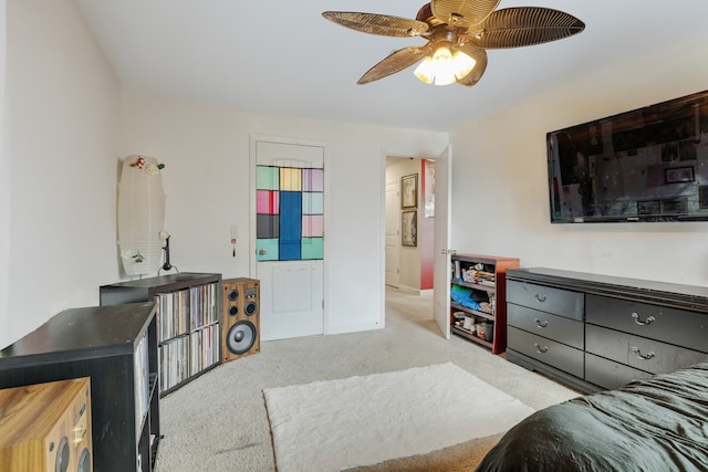 living room featuring ceiling fan and light colored carpet