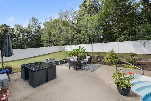 view of patio / terrace with an outdoor living space with a fire pit