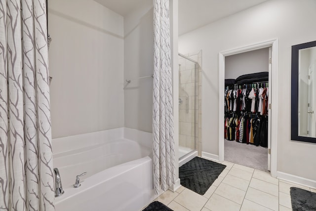 bathroom featuring independent shower and bath and tile patterned flooring