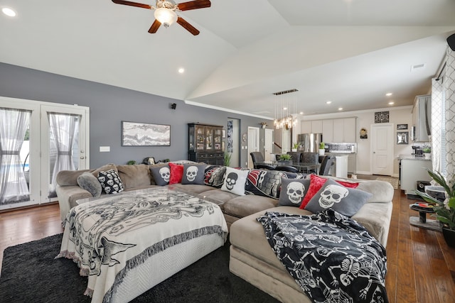 living room featuring crown molding, lofted ceiling, dark hardwood / wood-style flooring, and ceiling fan with notable chandelier