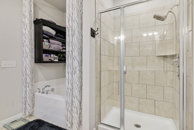 bathroom with separate shower and tub