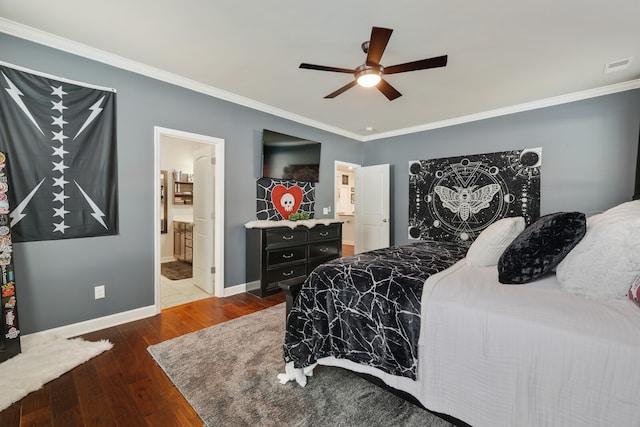 bedroom featuring ornamental molding, ensuite bathroom, dark hardwood / wood-style floors, and ceiling fan