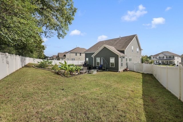 back of property with a patio area and a lawn