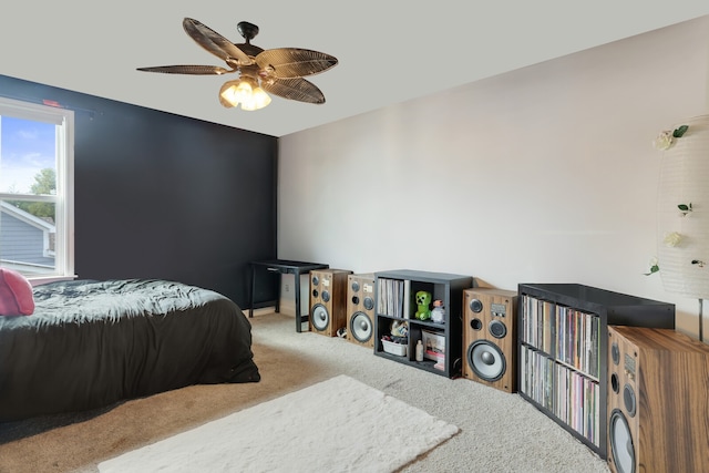 bedroom featuring light carpet and ceiling fan