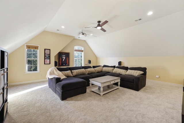 living room with light carpet, lofted ceiling, ceiling fan, and a wealth of natural light